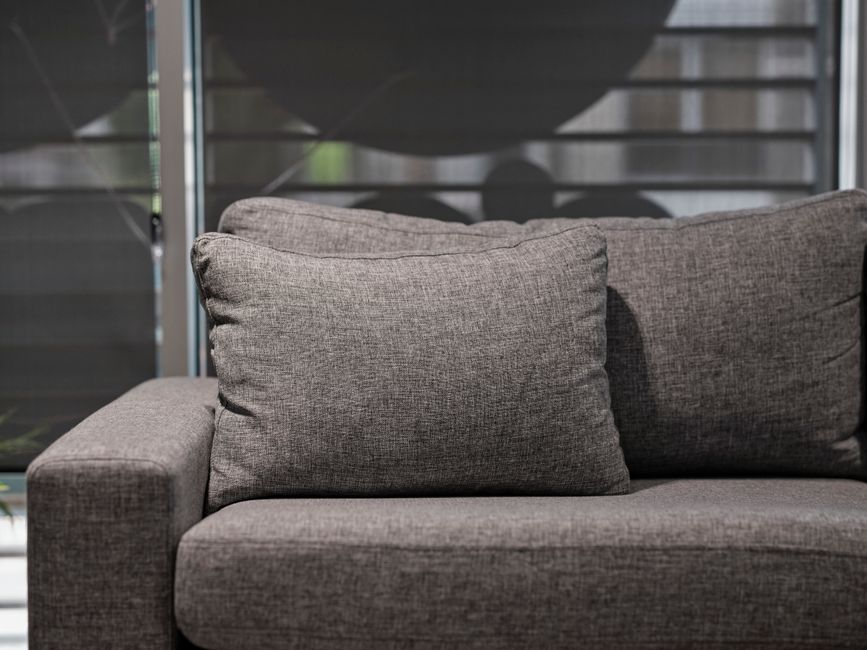 Expert upholstery cleaning on a living room sofa